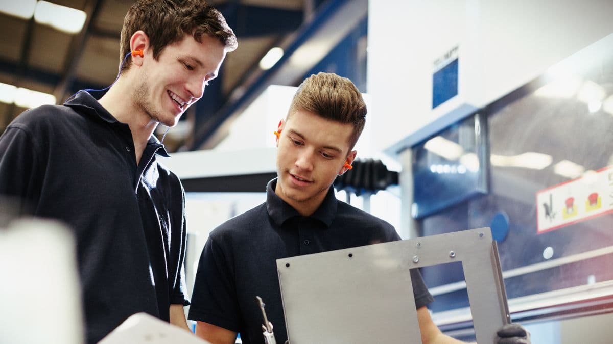 Two SolidProfessor team members talking with a customer.