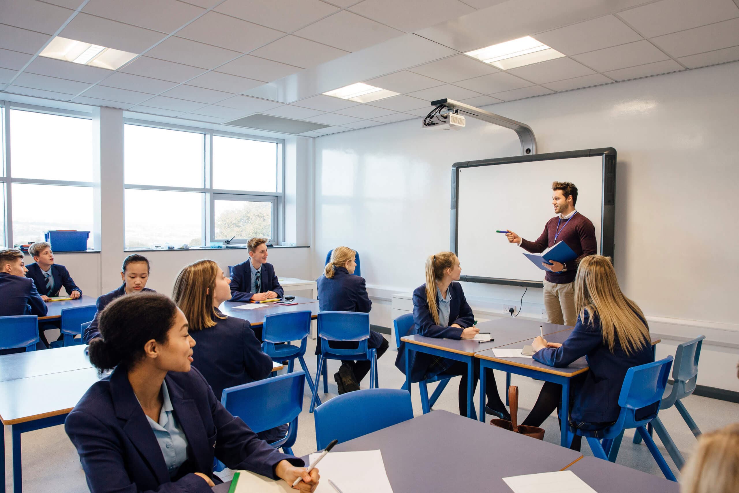 Teacher leading high school lesson in the classroom.